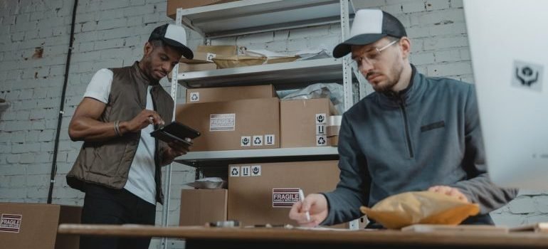 Two men in an office discussing the tips For vehicle storage
