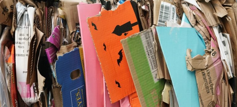a lot of cardboard being pressed