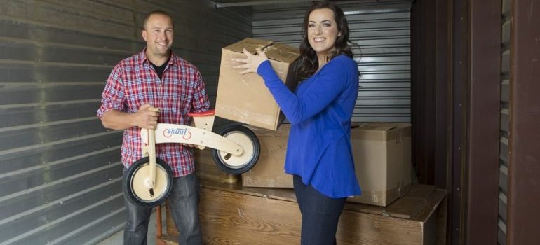 Couple ready for NYC apartment storage.