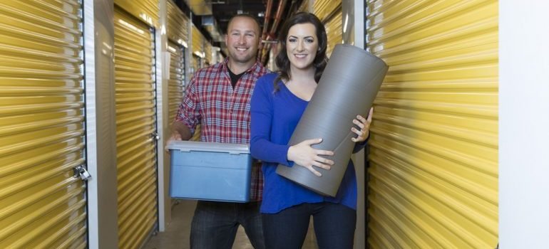 a couple in a storage facility hallway
