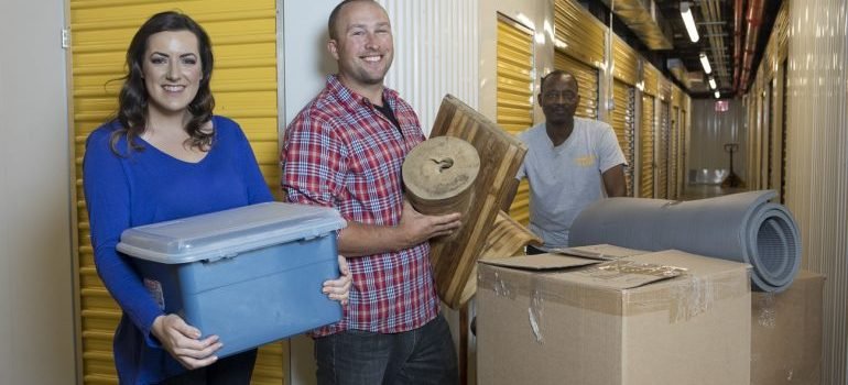 a couple putting items in secure self storage NYC
