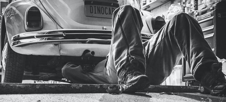 mechanic checking the vehicle