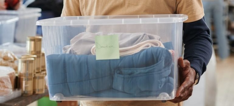 a guy with a plastic box