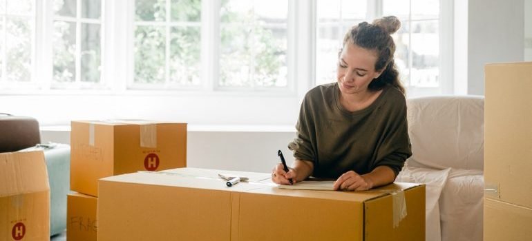 A woman making a checklist.