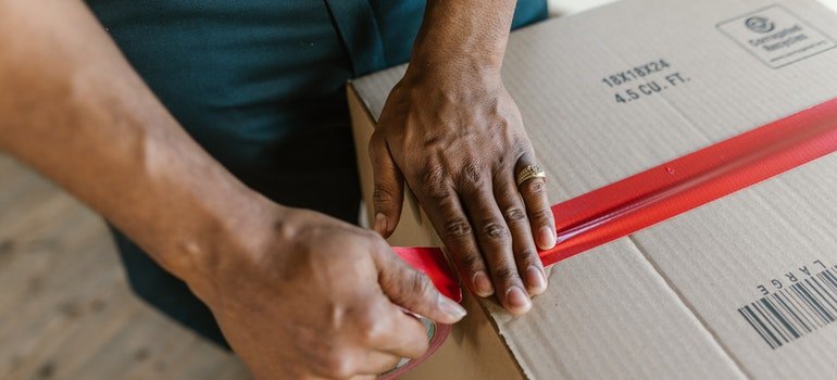 a man sealing the box