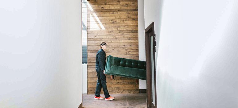 movers carrying furniture