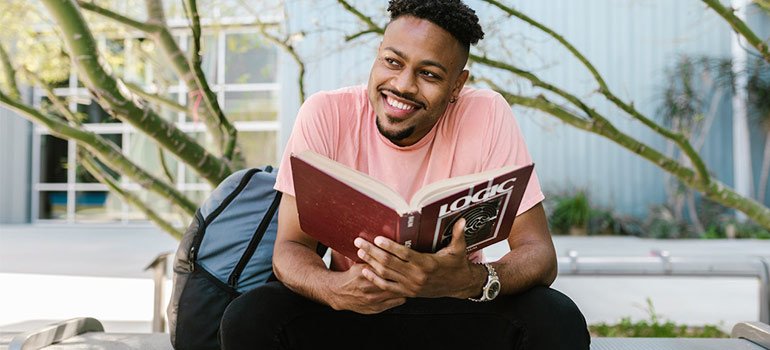 happy student holding a book