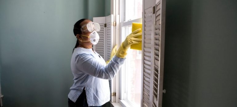 a woman cleaning the windows