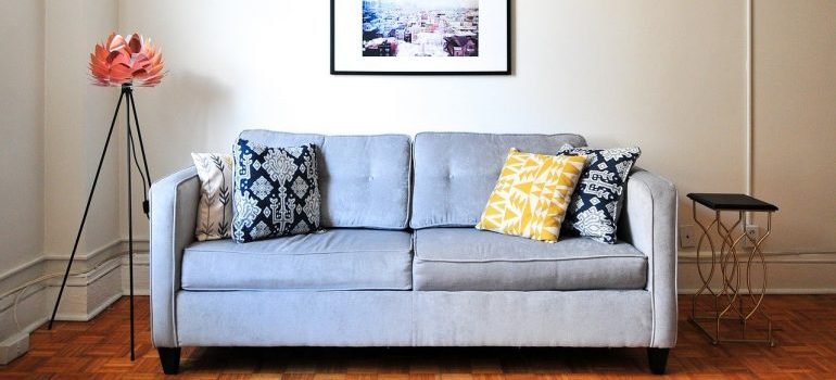 A grey sofa in a house.