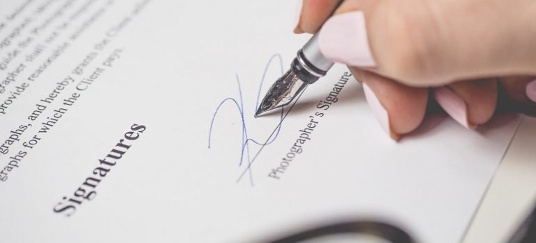 a person signing a document as part of the post-move paperwork you need to do
