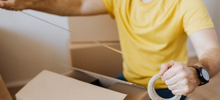 Taping a box.