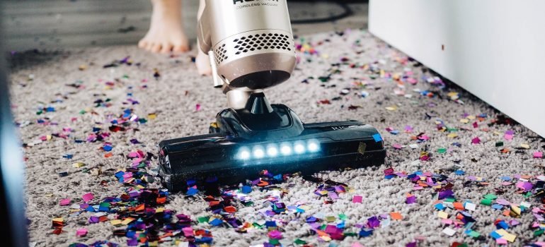 vacuuming the carpets