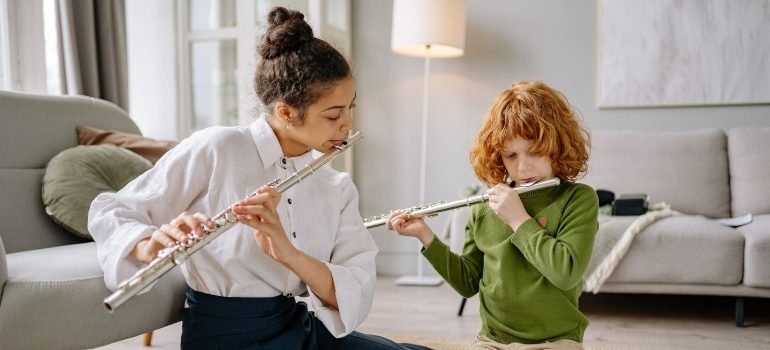 boy learning to play flute