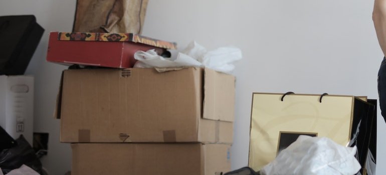 A girl showing how to boost your relocation budget by decluttering