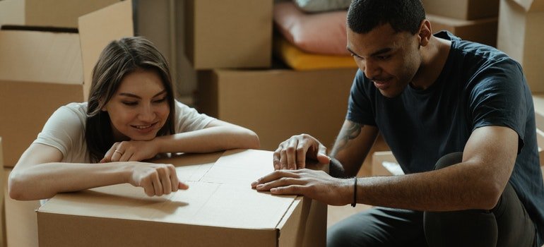 Couple looking at stuff to leave behind before storage.