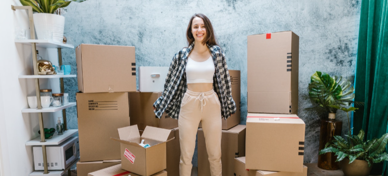 a woman among moving boxes