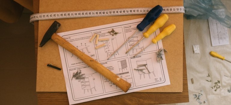 Hammer, surfactors, and original furniture manual.