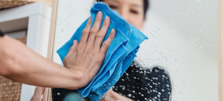 A woman cleaning before storing Valentine's Day decoration