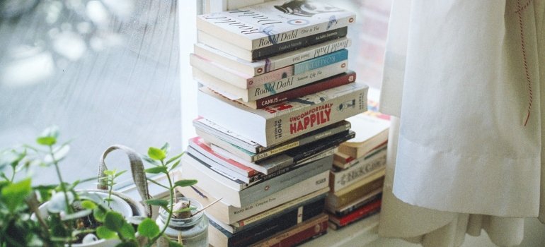Stacked books near the window