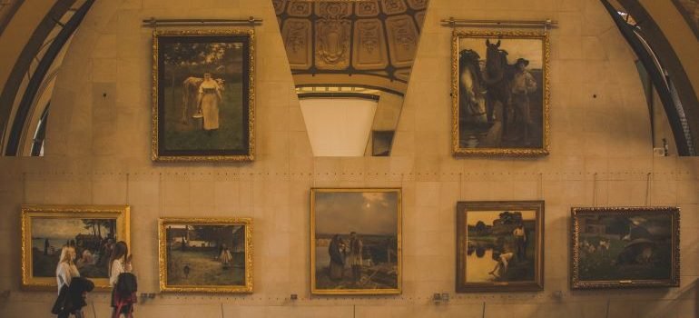 organize an art exhibit relocation to NYC