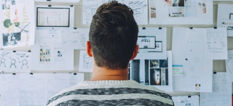Man looking at a storage plan.