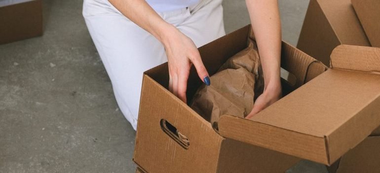 A woman preparing for packing and organizing a storage unit