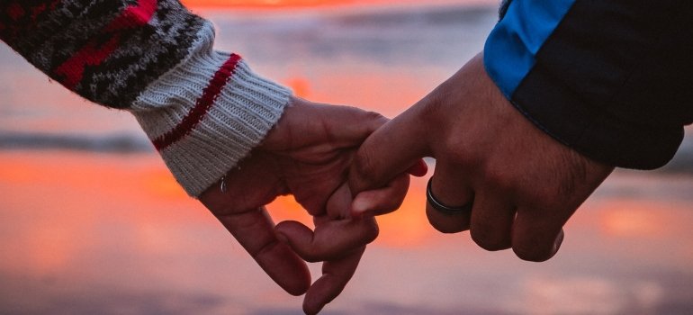 A man and a woman holding hands