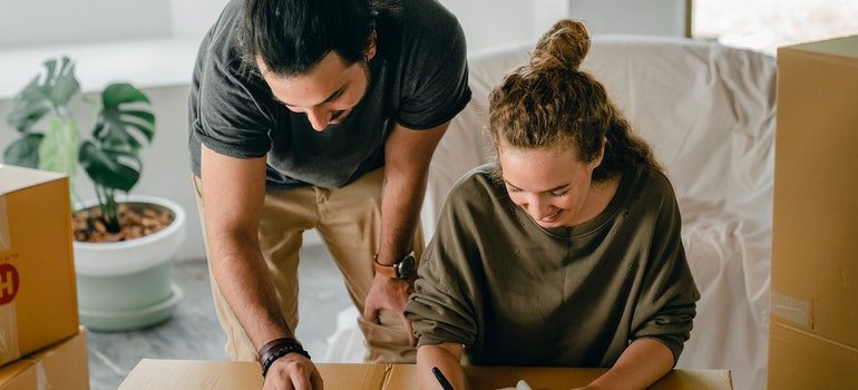 Couple preparing to declutter items.