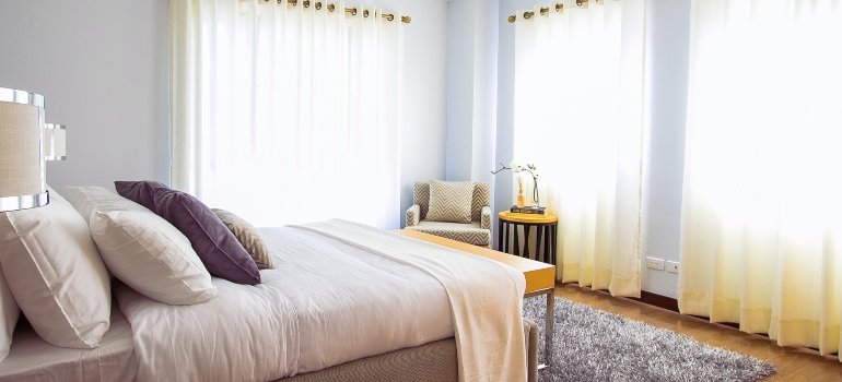 white walls in bedroom as a way to brighten up your new NYC home