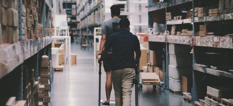 two guys inside an indoor storage unit