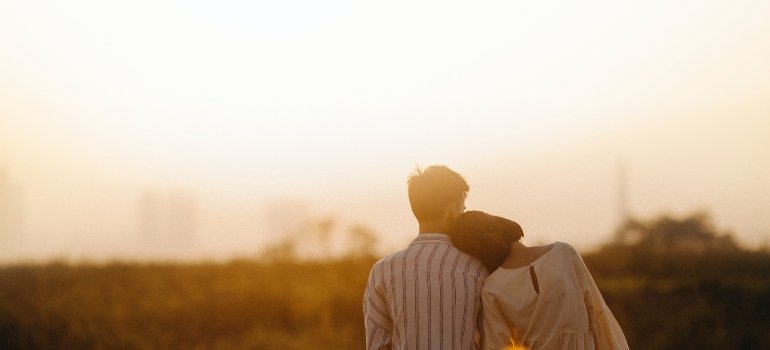 man and woman hugging