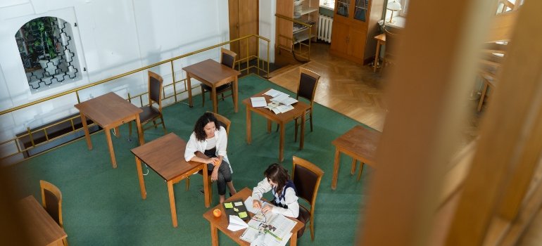 teacher and student talking about finding student housing in NYC