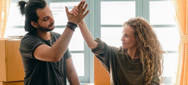A couple high fiving each other