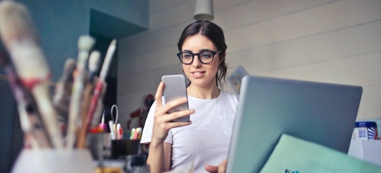 A woman reads storage tips for small business owners.