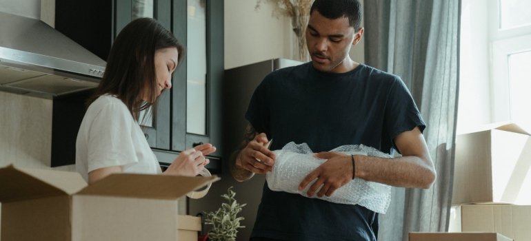 A man and a woman packing
