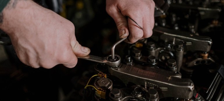 A mechanic fixing something