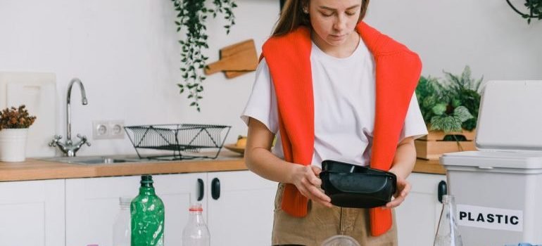 A young woman thinking about eco-friendly ways to pack delicate items