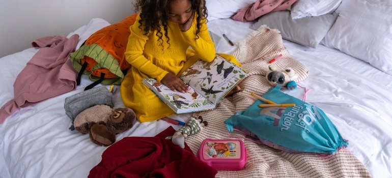 girl on bed reading