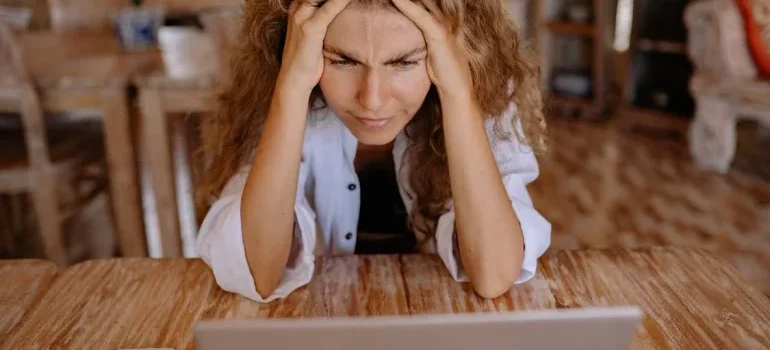 A woman reading a guide to apartment hunting in NYC