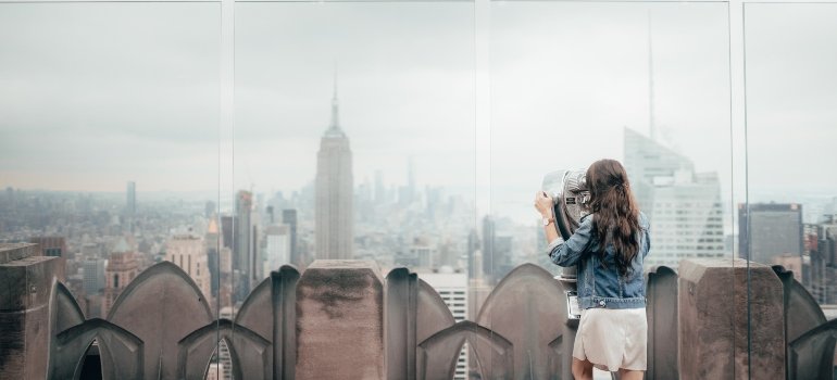 Woman looking through binoculars