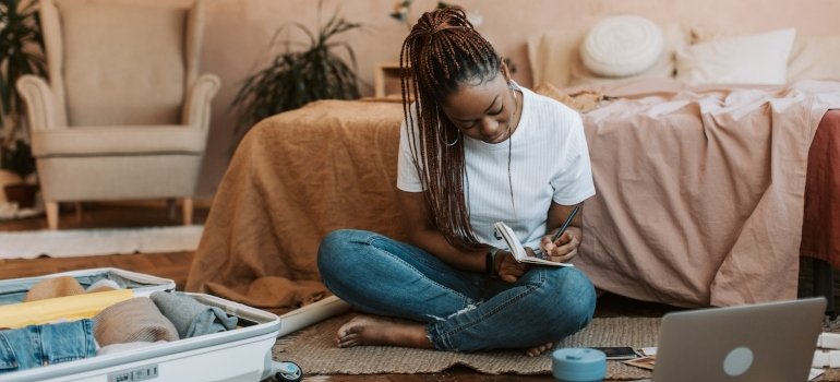 Girl making list of Essential items to pack for college