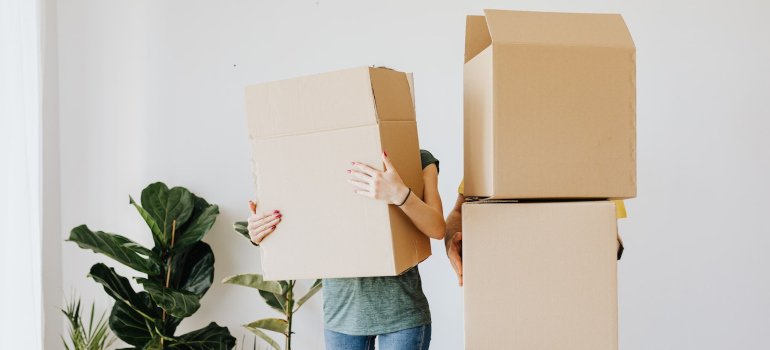a couple holding boxes