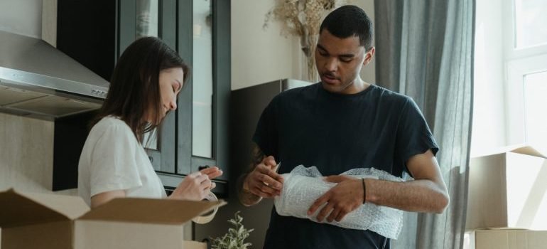 Couple packing for their move