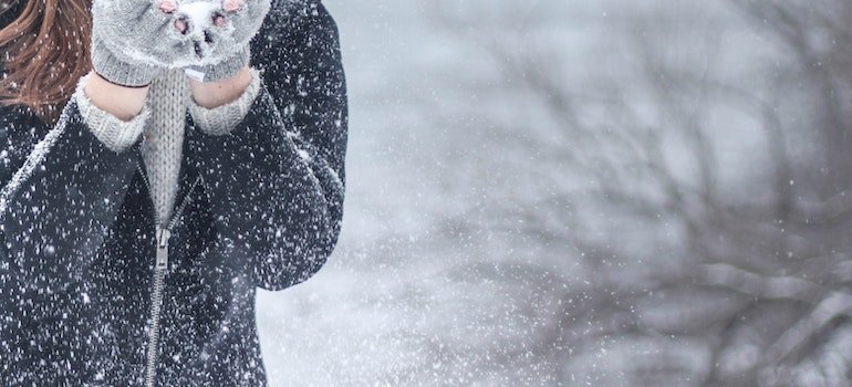 A girl playing with snow
