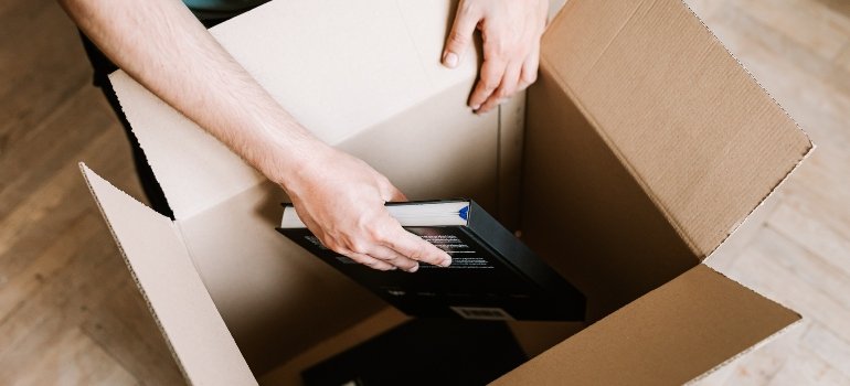 a person packing books