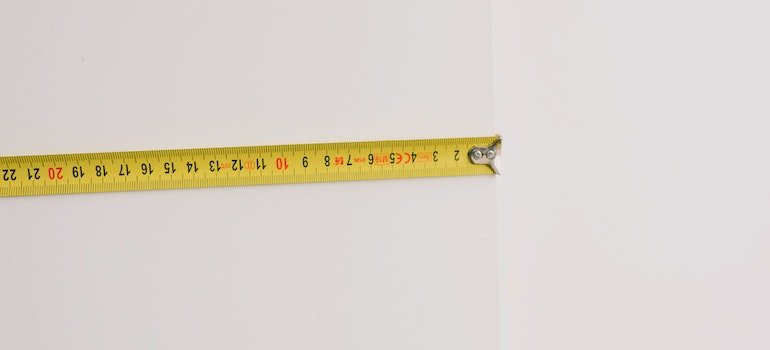 measurement tape measuring wall ad one of the points to consider while choosing storage units