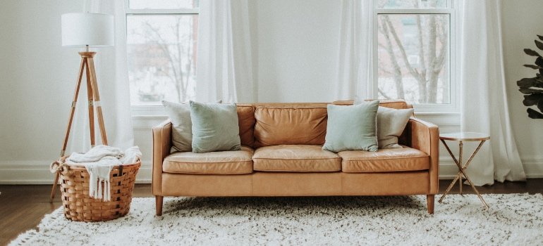 A contemporary living room with a white rug.