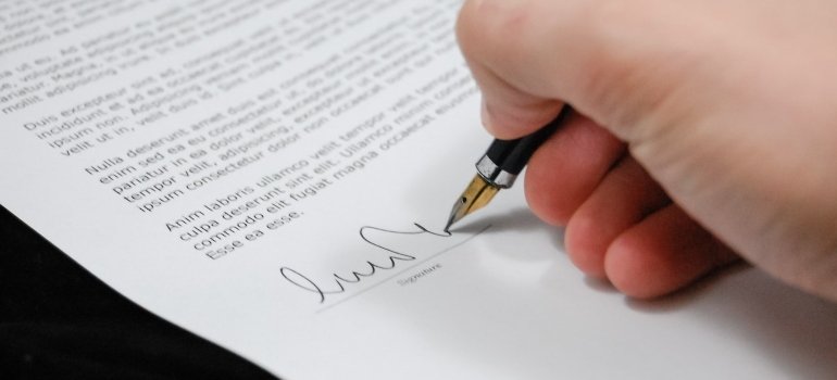 a person signing a contract