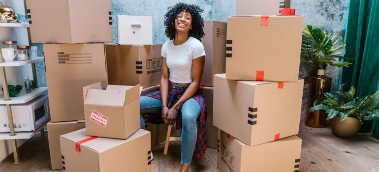 woman surrounded by boxes