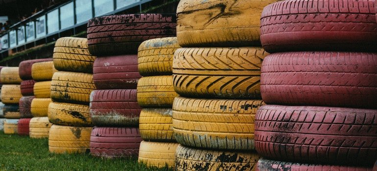 a pile of yellow and red tires